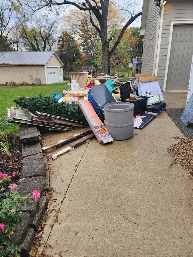 Dumpster being loaded with debris for 3 Yard Dumpster Rental in New Castle